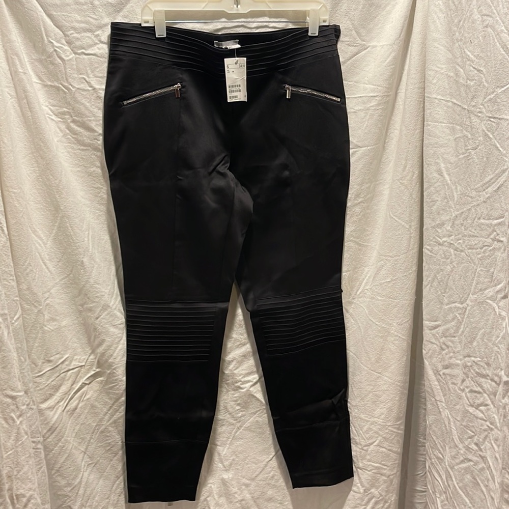 Black satin leggings with front zipper pockets